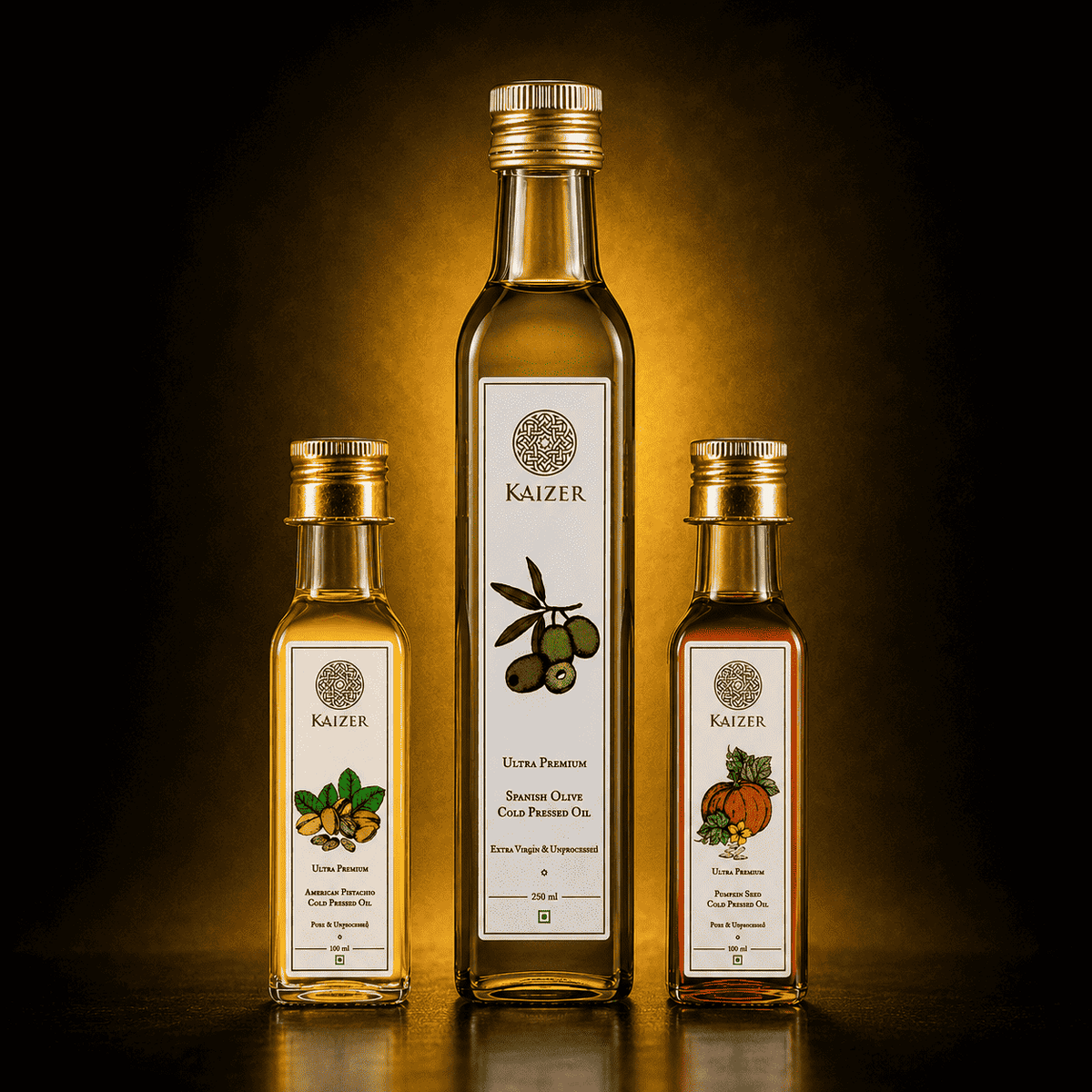 Three bottles of Kaizer oils (Pistachio, Olive & Pumpkin Seed) with labels on a dark background