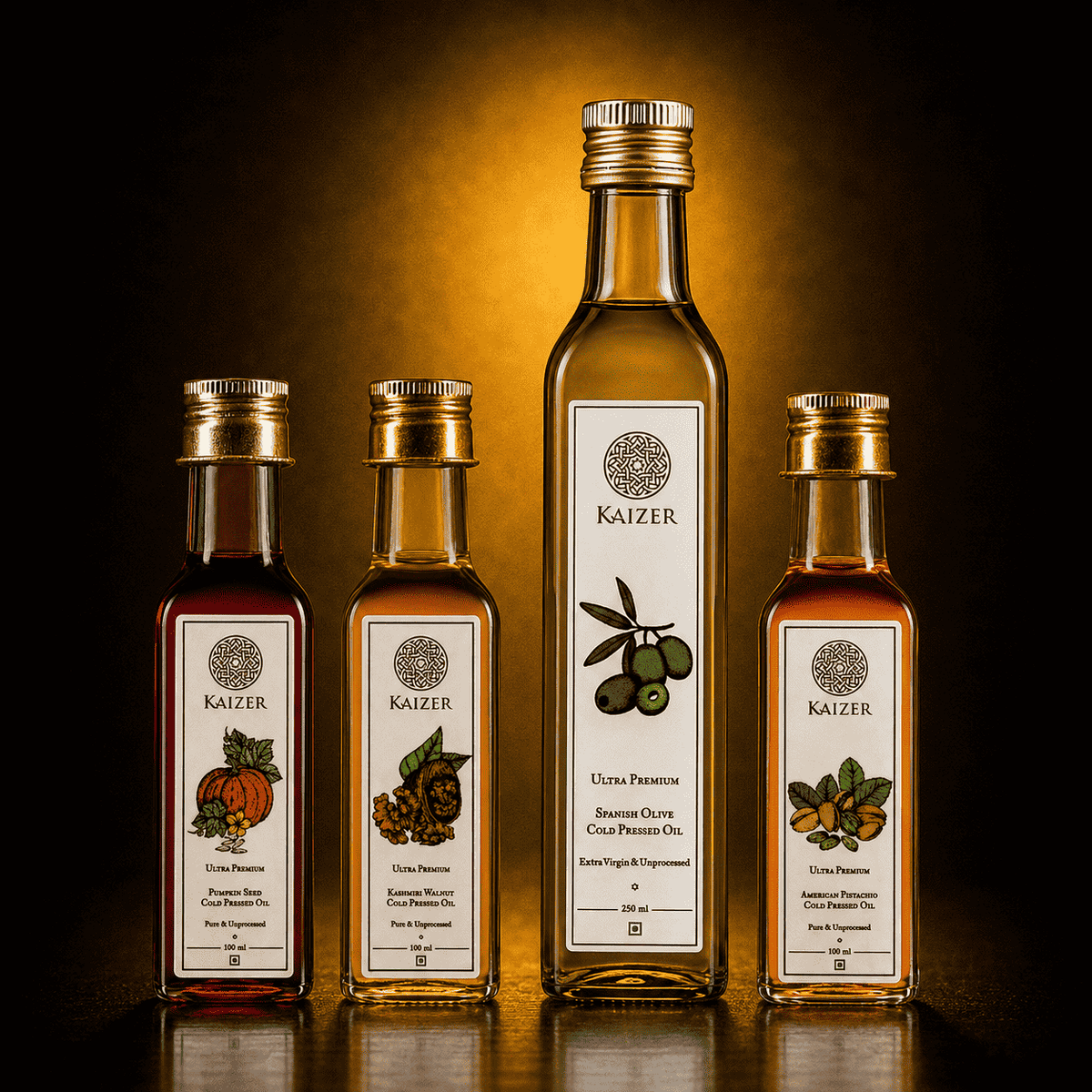 Four Kaizer branded glass bottles of oil arranged on a reflective surface against a dark background with a warm golden glow. The center bottle is tall and contains pale yellow oil, while the surrounding bottles are shorter and contain red, green, and amber liquids with illustrated labels.