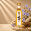 A bottle of Kaizer Pure Flaxseed Oil stands on a wooden tray with surrounding product callouts, seeds, burlap, and purple flowers on a warm beige background.