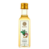 A clear glass bottle filled with almond oil, labeled 'Kaizer Kashmiri Almond Oil' with additional text and an illustration of almonds.