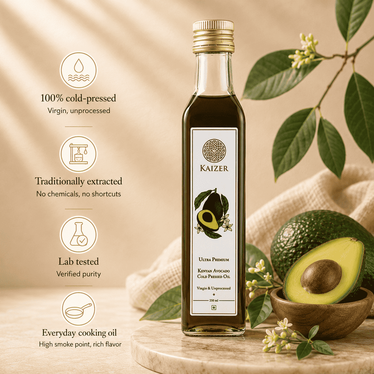 A bottle of Kaizer Kenyan Avocado Oil stands on a wooden board next to whole and sliced avocados in a bowl, with warm beige fabric and leafy branches in the background. Text on the left highlights key product benefits: 100% cold-pressed virgin oil, traditionally extracted, lab tested, and suitable for everyday cooking.