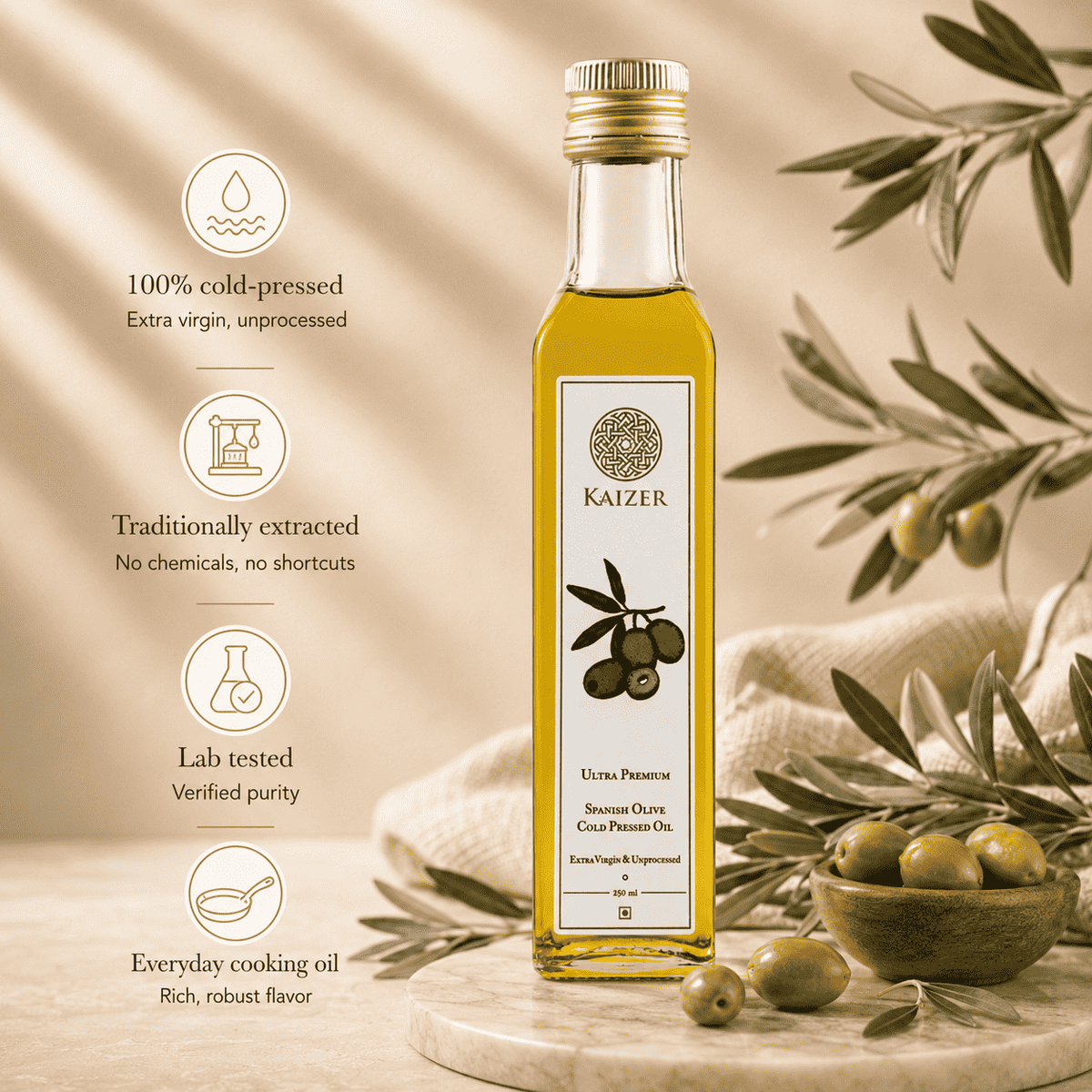 Bottle of Kaizer Spanish Olive Oil placed next to a bowl of olives. 