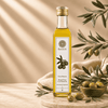 Bottle of Kaizer Spanish Olive Oil placed next to a bowl of olives. 