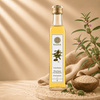 A bottle of Kaizer White Sesame Oil with  sesame plant and seeds next to it and the text 'Ultra Premium', indicating its high quality.
