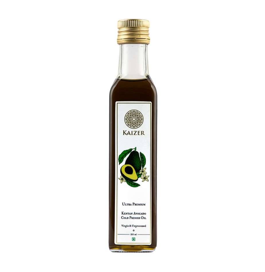 A bottle of Kaizer brand Kenyan Avocado Oil with a label that includes an illustration of an avocado and some decorative elements. The oil is presented as a clear product with a greenish tint.
